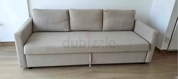 Light beige 3-seater fabric sofa bed in good condition