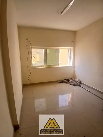 A one-bedroom apartment with a living room for annual rent in Al Rumailah 1, Ajman, located on the
