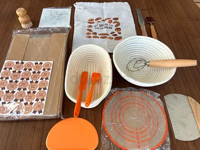Sourdough / Bread baking set with bannetons, packaging, dough scraper, whisker, and silicone mat