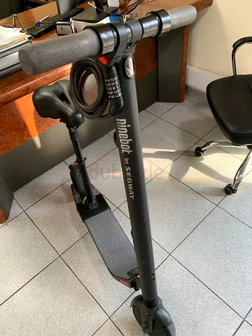 Ninebot kick electric scooter with added seat ,with company original charger,lock  25 km rang