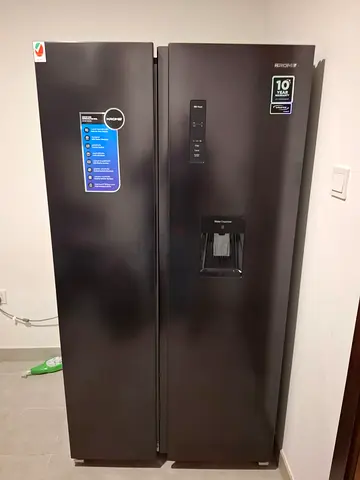 Side-by-Side Refrigerator with Water Dispenser — Black, Good Condition