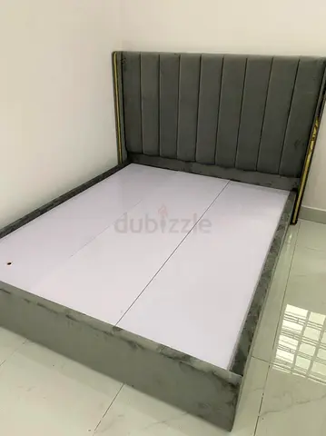 Grey velvet double bed frame with padded headboard