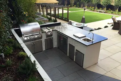 Outdoor BBQ bar counter with pergola and built-in sink