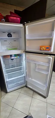 Used double-door refrigerator with freezer - good working condition