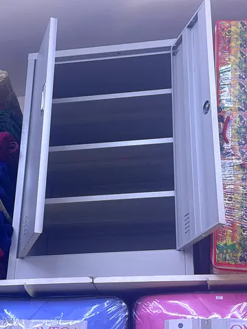 White metal storage cabinet with lockable double doors - good condition