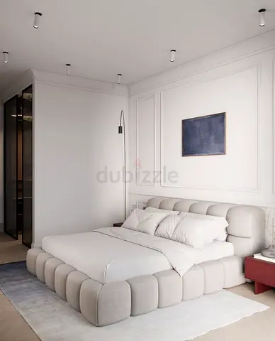 Low-profile tufted platform bed with upholstered headboard