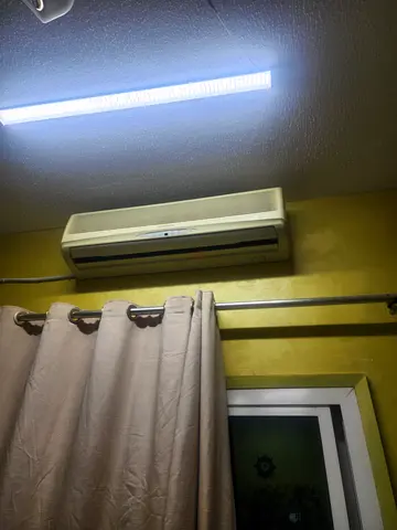 Used wall-mounted split air conditioner - working in good condition