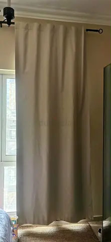 Light beige blackout curtains with eyelet header - single panel