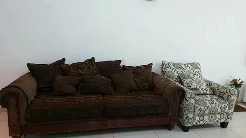 Brown patterned 3-seater sofa with matching cushions + single patterned armchair