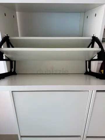 White built-in wardrobe/cabinet with shelves — good condition