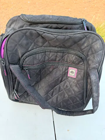 Black quilted backpack with multiple compartments - used