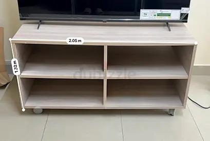 Light wood TV stand / entertainment unit with 4 open shelves and wheels
