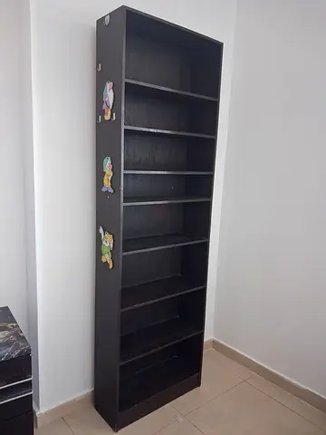 Tall dark wooden bookshelf with 8 compartments