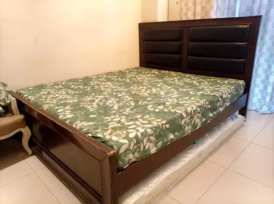 KING SIZE wooden bed frame with padded headboard - good condition