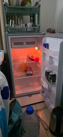 Small single-door mini fridge in working condition