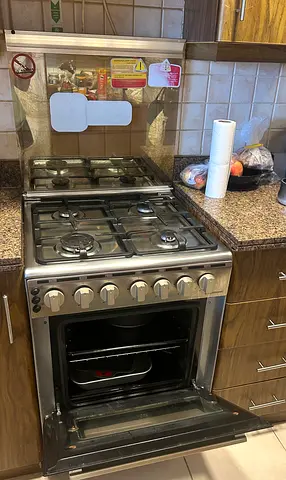 Stainless Steel 4-Burner Gas Cooker with Oven - Good Working Condition