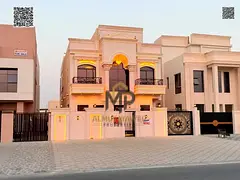 A luxurious classic-style villa in Al Helio 2, situated on a main road. It features a 15-meter front