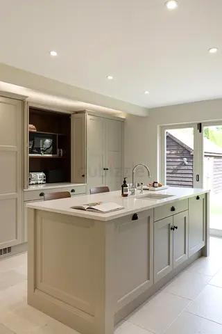 Modern shaker-style kitchen island with cabinets and breakfast bar