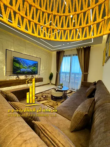 Luxury apartment for monthly rent, two bedrooms and a hall with a sea view, fully furnished with high-end hotel furniture and a fully equipped kitchen