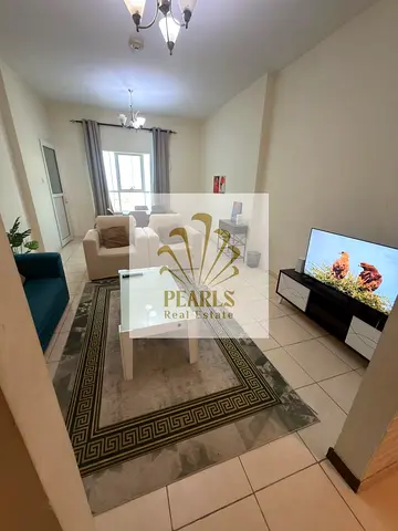 Luxury Furnished 1-Bedroom Apartment for Annual Rent in Al Rashidiya 1, Ajman, Orient Towers, Directly on Al Mina Street, 2 Bathrooms, Full Kitchen,