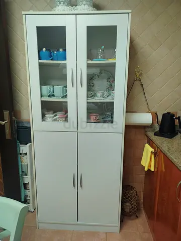 White tall kitchen cabinet with glass display doors