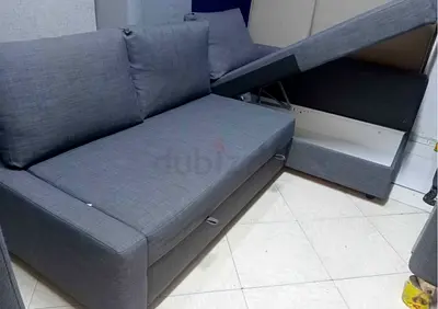 Grey L-shaped storage sofa bed, good condition