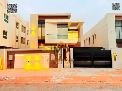 Luxury villa for sale in Al Muwaihat (5,000 sq. ft.) – Exceptional location near all amenities; includes water, electricity, and air conditioning. Dir