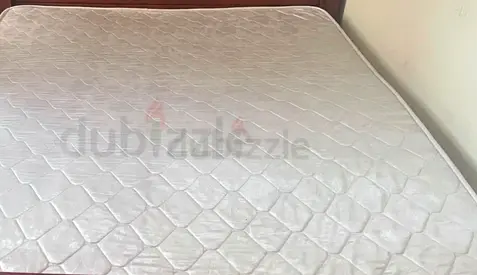 Used double mattress with stain-free surface, good support queen size mattress