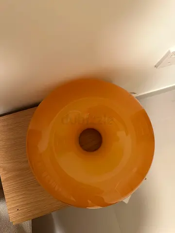 Orange donut-shaped decorative table lamp Ikea Varmblixt