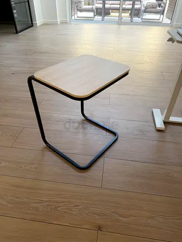 Light wood side table with black metal frame - compact C-shape
