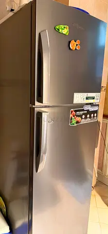 Silver double-door refrigerator - good working condition