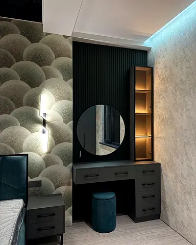 Modern fitted bedroom vanity desk with illuminated shelving and mirror