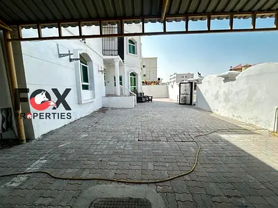 Commercial villa for rent in Al Rawda 1, Ajman. 8 rooms, 4 bathrooms, living room, majlis, shaded a