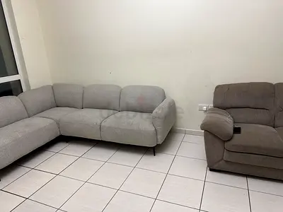 Light grey L-shaped fabric sofa (3-seater corner) with single recliner