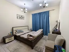 Fully Furnished Master Bedroom with wardrobes with ensuite washroom. 1 min walk to Burjuman metro