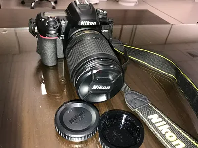 Nikon D7500 DSLR with 18-140mm Lens and Strap, additional original battery, bag- Good Conditions