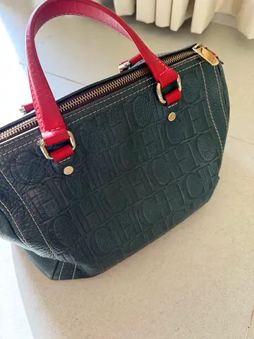 Dark green embossed handbag with red handles - good used condition