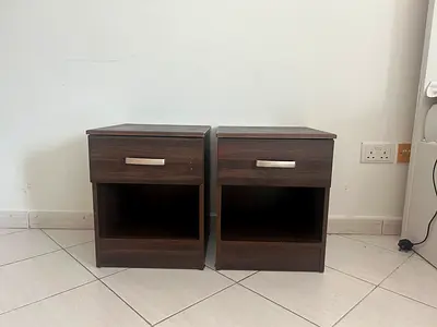 Pair of dark wood bedside tables / nightstands with drawer and shelf