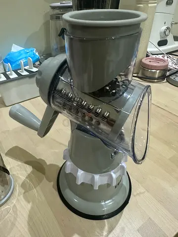 Used manual rotary vegetable slicer / grater with multiple drums