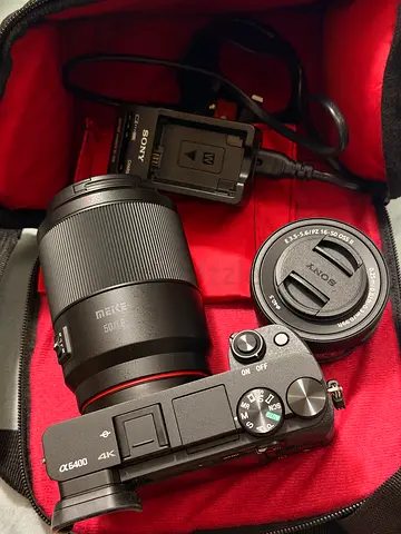Sony a6400 with 2 lens. 16-50mm kit lens and 50mm mike and with dji rs mini 3 used 1 time only