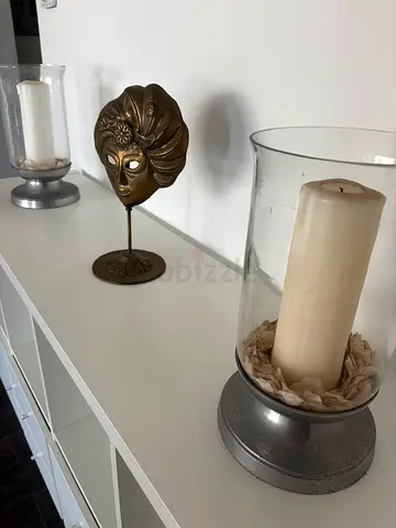 Pair of glass pilar candle holders with decorative accents