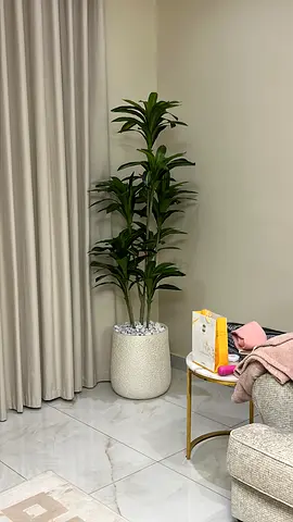 Tall artificial indoor plant with decorative pot - like new
