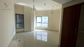 Two-bedroom apartment with a living room, balcony, maid's room, laundry room, and an open view acros