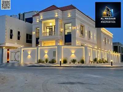 Luxury Corner Villa for Sale in Al Helio 2 – Ajman | Two Floors Plus Roof | Stone Facade | Corner Plot (Two Streets) | Facing Amenities | Registration