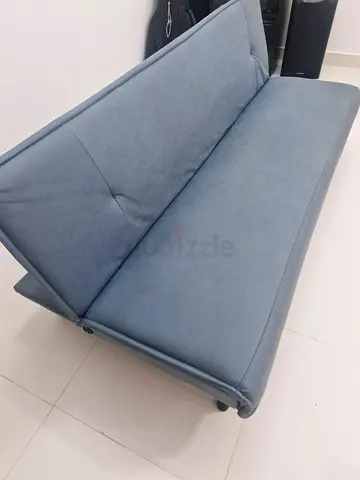 Blue 3-seater Sofa Bed / Futon in Good Condition with coffee table