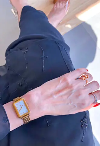 Gold-tone rectangular women's wristwatch with metal bracelet
