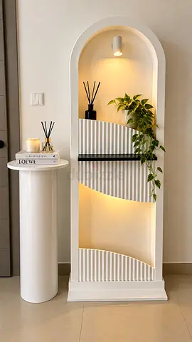 Tall white decorative shelving niche with built-in lighting