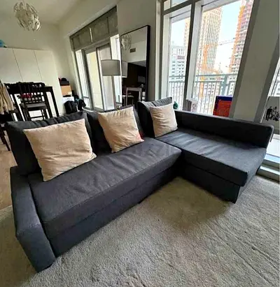 Dark grey L-shaped corner sofa bed with chaise - good condition