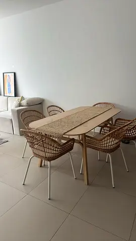 Ikea Light wooden dining table with 2 rattan-style chairs
