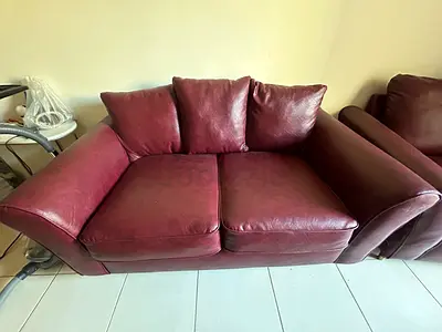 Maroon Leather 2-Seater Sofa in Good Used Condition